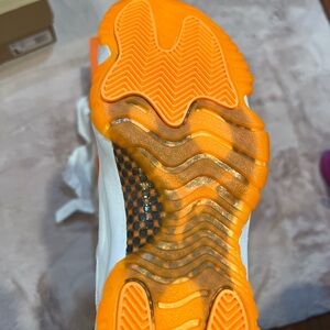 Orange and white Jordans. Women’s Size 9. Worn once. Like new.